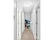 Bright hallway featuring neutral walls, carpet, and access to a living area with a fireplace at 111 Amberwood Ln, Euharlee, GA 30145