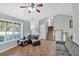 Bright living room with large windows, hardwood floors, and comfortable seating at 111 Amberwood Ln, Euharlee, GA 30145