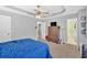 Spacious main bedroom with ceiling fan, carpeting, and doorway to ensuite bath at 111 Amberwood Ln, Euharlee, GA 30145