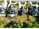 Aerial view of luxurious homes with pools and manicured lawns, showcasing the neighborhood's upscale amenities and landscaping at 2331 Kinsale Nw Pt, Kennesaw, GA 30152