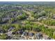 Gorgeous aerial view of homes near a scenic lake and golf course, highlighting the neighborhood's recreational amenities at 2331 Kinsale Nw Pt, Kennesaw, GA 30152