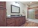 Well-appointed bathroom featuring a granite vanity and tiled shower at 2331 Kinsale Nw Pt, Kennesaw, GA 30152