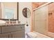 Bathroom with granite countertop and frosted glass shower door at 2331 Kinsale Nw Pt, Kennesaw, GA 30152