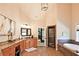 This bathroom boasts granite counters, a separate tub, a glass-enclosed shower, and ample space for getting ready at 2331 Kinsale Nw Pt, Kennesaw, GA 30152