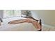Comfortable bedroom featuring a soft bed with plush bedding and a cozy blanket, creating a relaxing retreat at 2331 Kinsale Nw Pt, Kennesaw, GA 30152