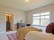 Bright bedroom with large window and ensuite bathroom access at 2331 Kinsale Nw Pt, Kennesaw, GA 30152