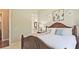 Comfortable bedroom features a wood bed frame, neutral walls and decor, with an ensuite bathroom at 2331 Kinsale Nw Pt, Kennesaw, GA 30152