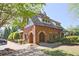Charming community building with unique architectural details and brick exterior, providing a welcoming gathering space at 2331 Kinsale Nw Pt, Kennesaw, GA 30152