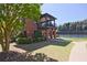 Beautiful community exterior with well-maintained lawn, tennis court, patio, and lush trees creating a vibrant outdoor space at 2331 Kinsale Nw Pt, Kennesaw, GA 30152