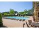 Large community pool with lounge chairs and tables perfect for relaxing and enjoying the sunny weather at 2331 Kinsale Nw Pt, Kennesaw, GA 30152