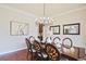 Formal dining room with elegant dark wood table and chandelier, perfect for hosting dinner parties at 2331 Kinsale Nw Pt, Kennesaw, GA 30152