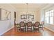 Formal dining room with an elegant chandelier and decorative chairs around a wooden table at 2331 Kinsale Nw Pt, Kennesaw, GA 30152