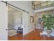 Bright foyer with hardwood floors, a sliding barn door, and a two-story open ceiling at 2331 Kinsale Nw Pt, Kennesaw, GA 30152