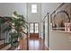 Elegant foyer with hardwood floors, a staircase, and a sliding barn door at 2331 Kinsale Nw Pt, Kennesaw, GA 30152