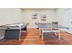 Recreation area features air hockey and ping pong on wood floors at 2331 Kinsale Nw Pt, Kennesaw, GA 30152