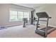 Home gym equipped with a treadmill and weight machine offers a private workout space at 2331 Kinsale Nw Pt, Kennesaw, GA 30152