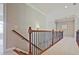Upstairs hallway with wooden banister at 2331 Kinsale Nw Pt, Kennesaw, GA 30152