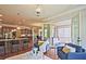 Inviting living room featuring hardwood floors and glass doors opening to a screened porch at 2331 Kinsale Nw Pt, Kennesaw, GA 30152