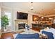 Open concept living space with stone fireplace, and direct kitchen access, ideal for entertaining at 2331 Kinsale Nw Pt, Kennesaw, GA 30152