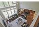Spacious living room featuring high ceilings, large windows, and comfortable seating perfect for entertaining at 2331 Kinsale Nw Pt, Kennesaw, GA 30152