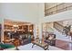 Bright living room with an open floor plan, high ceilings, and views of the staircase at 2331 Kinsale Nw Pt, Kennesaw, GA 30152