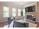 Bright living room with stone fireplace, and large windows to give an abundance of natural light at 2331 Kinsale Nw Pt, Kennesaw, GA 30152