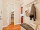 Convenient mudroom area with bench seating, coat hooks, and pantry access at 2331 Kinsale Nw Pt, Kennesaw, GA 30152