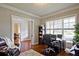 Comfortable home office with natural light, workspace, and reading chair at 2331 Kinsale Nw Pt, Kennesaw, GA 30152