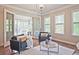 Cozy sunroom with lots of natural light and comfortable seating area at 2331 Kinsale Nw Pt, Kennesaw, GA 30152