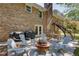 Spacious backyard offers a patio with seating, grill, and fire pit, perfect for outdoor gatherings at 3397 Old Jonesboro Rd, Hapeville, GA 30354
