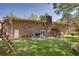 Brick house backyard with patio, grill, spiral staircase, and grass is great for entertaining friends at 3397 Old Jonesboro Rd, Hapeville, GA 30354