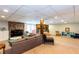 Spacious finished basement featuring a stone fireplace and neutral carpeting at 3397 Old Jonesboro Rd, Hapeville, GA 30354