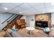 Cozy finished basement with a piano, stone fireplace, and comfortable seating area at 3397 Old Jonesboro Rd, Hapeville, GA 30354