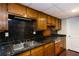 Basement kitchenette with vintage appliances and dark countertops at 3397 Old Jonesboro Rd, Hapeville, GA 30354