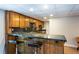 Basement bar with a countertop, cabinets, and bar stools at 3397 Old Jonesboro Rd, Hapeville, GA 30354