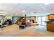 Finished basement featuring a desk, piano, and patio doors at 3397 Old Jonesboro Rd, Hapeville, GA 30354