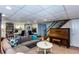 Finished basement with a desk, piano, and staircase at 3397 Old Jonesboro Rd, Hapeville, GA 30354