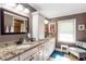 Bright bathroom featuring double sinks, granite counters and ample storage at 3397 Old Jonesboro Rd, Hapeville, GA 30354