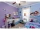 Cozy bedroom with colorful walls, a ceiling fan, and ample natural light at 3397 Old Jonesboro Rd, Hapeville, GA 30354