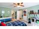 Comfortable bedroom with green walls, ceiling fan, and plenty of storage at 3397 Old Jonesboro Rd, Hapeville, GA 30354