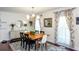 Elegant dining room featuring modern lighting, hardwood floors, and stylish decor at 3397 Old Jonesboro Rd, Hapeville, GA 30354