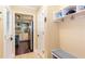Entryway featuring tile floors, coat hooks, and a view into the adjacent kitchen area at 3397 Old Jonesboro Rd, Hapeville, GA 30354