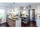 Modern kitchen featuring granite countertops, a stone accent wall, and stainless steel appliances at 3397 Old Jonesboro Rd, Hapeville, GA 30354