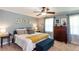 Main bedroom features a large bed, dresser, and natural lighting at 3397 Old Jonesboro Rd, Hapeville, GA 30354