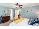 Main bedroom with neutral paint and ceiling fan, with a view to other rooms at 3397 Old Jonesboro Rd, Hapeville, GA 30354