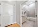 Bathroom with neutral tile, granite vanity, framed art, and a shower and tub combo at 44 Peachtree Nw Pl # 528, Atlanta, GA 30309
