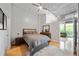 Bedroom with hardwood floors and direct access to the balcony and living room at 44 Peachtree Nw Pl # 528, Atlanta, GA 30309
