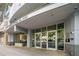 Modern building entrance with glass doors and sleek architectural design for a professional look at 44 Peachtree Nw Pl # 528, Atlanta, GA 30309