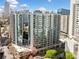 Luxury high rise condo building in the city with glass windows and surrounding skyline views at 44 Peachtree Nw Pl # 528, Atlanta, GA 30309