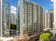 High-rise condo building with floor-to-ceiling windows and private balconies offering stunning city views at 44 Peachtree Nw Pl # 528, Atlanta, GA 30309